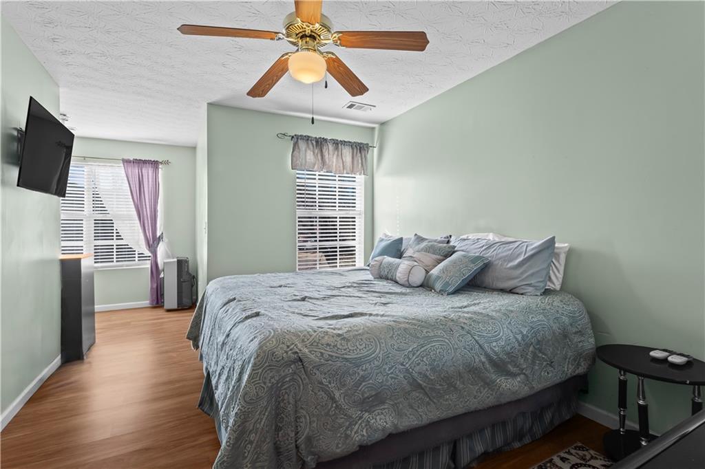 3000 Western Sunset Decatur, GA 30034 - Photo 23 of 37 a bedroom with a bed and a flat screen tv