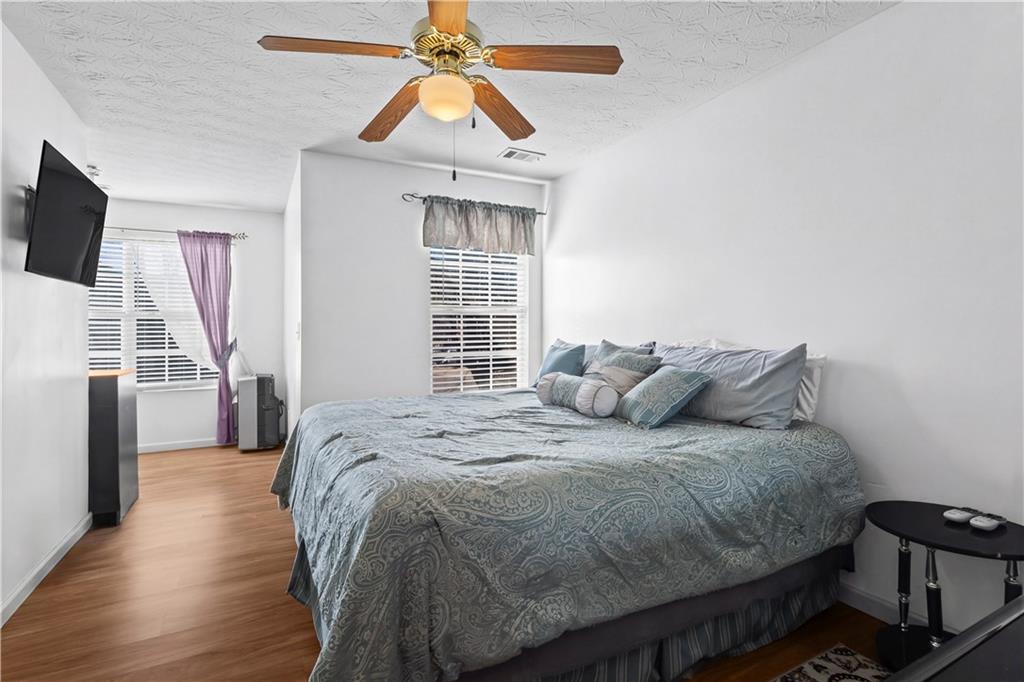 3000 Western Sunset Decatur, GA 30034 - Photo 24 of 37 a bedroom with a bed and a flat screen tv