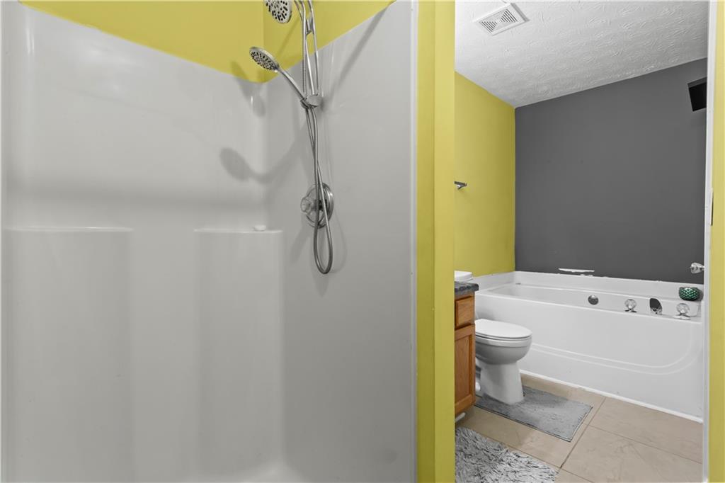 3000 Western Sunset Decatur, GA 30034 - Photo 27 of 37 a bathroom with a sink a toilet and shower