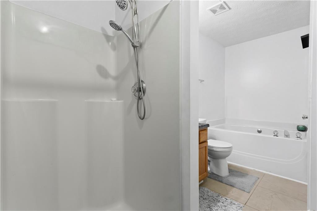 3000 Western Sunset Decatur, GA 30034 - Photo 28 of 37 a bathroom with a toilet a sink and shower