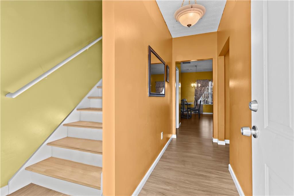 3000 Western Sunset Decatur, GA 30034 - Photo 3 of 37 a view of a hallway with wooden floor and staircase