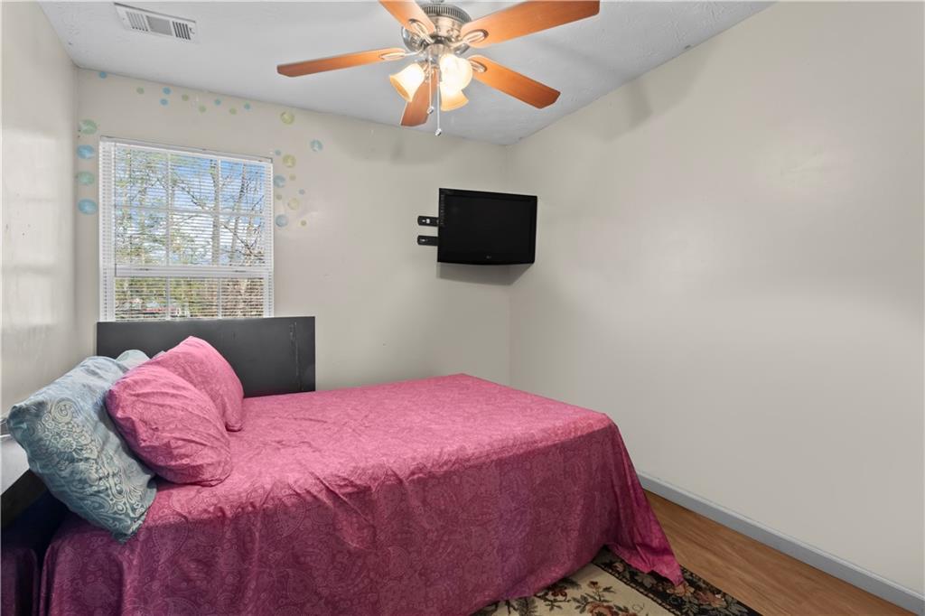 3000 Western Sunset Decatur, GA 30034 - Photo 31 of 37 a bedroom with a bed and a flat screen tv