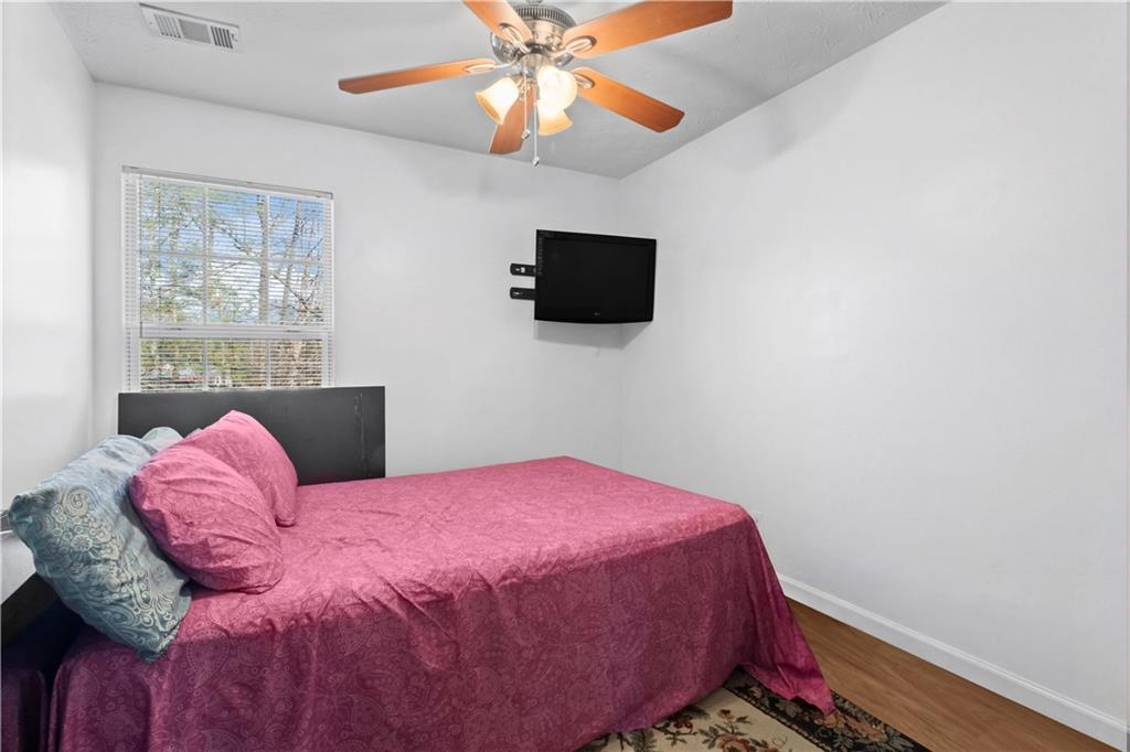 3000 Western Sunset Decatur, GA 30034 - Photo 32 of 37 a bedroom with a bed and a flat screen tv