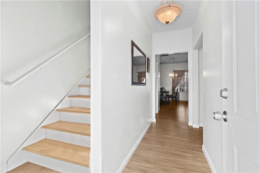 3000 Western Sunset Decatur, GA 30034 - Photo 4 of 37 a view of a hallway with wooden floor and staircase