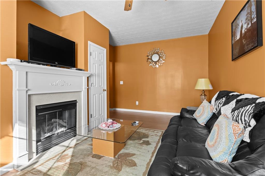 3000 Western Sunset Decatur, GA 30034 - Photo 9 of 37 a living room with furniture and a fireplace