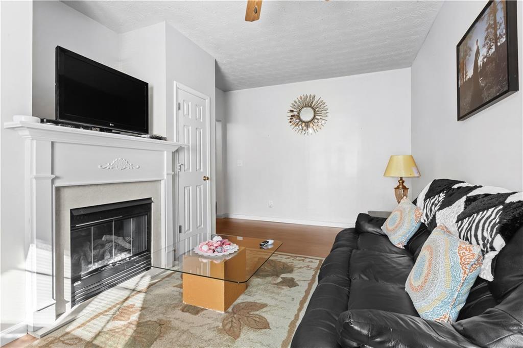 3000 Western Sunset Decatur, GA 30034 - Photo 10 of 37 a living room with furniture and a fireplace