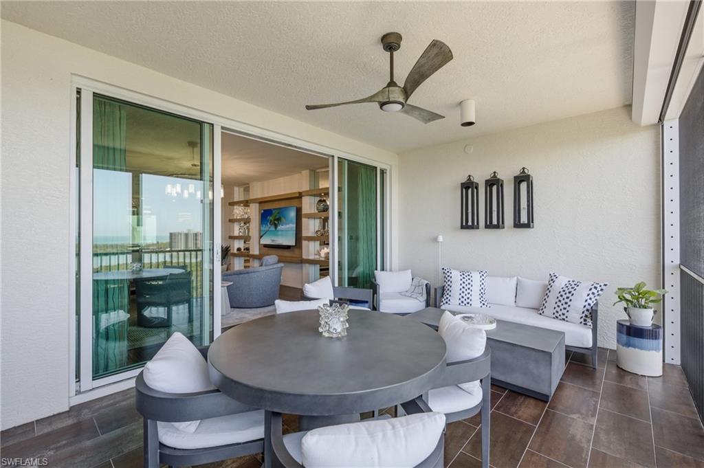 265 Indies Way, Unit 1004 Naples, FL 34110 - Photo 21 of 34 a living room with furniture and a large window