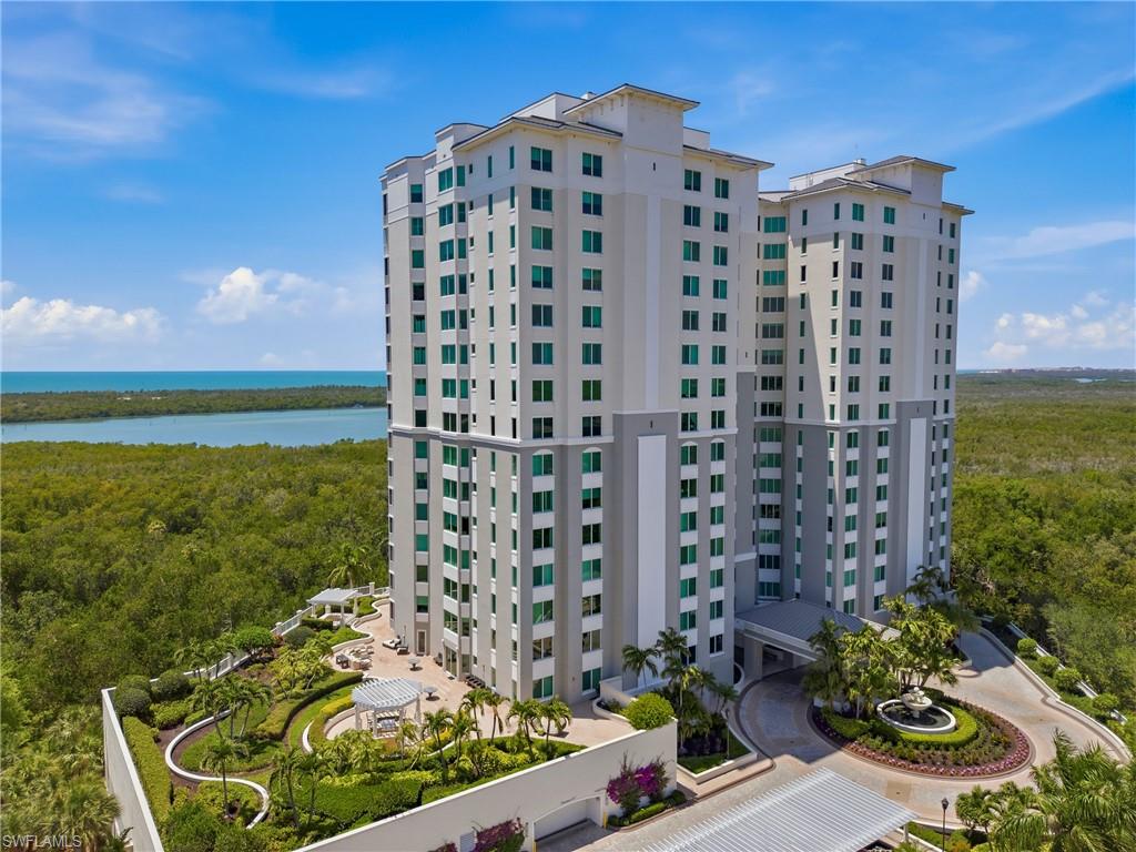 265 Indies Way, Unit 1004 Naples, FL 34110 - Photo 23 of 34 a building view with a garden space