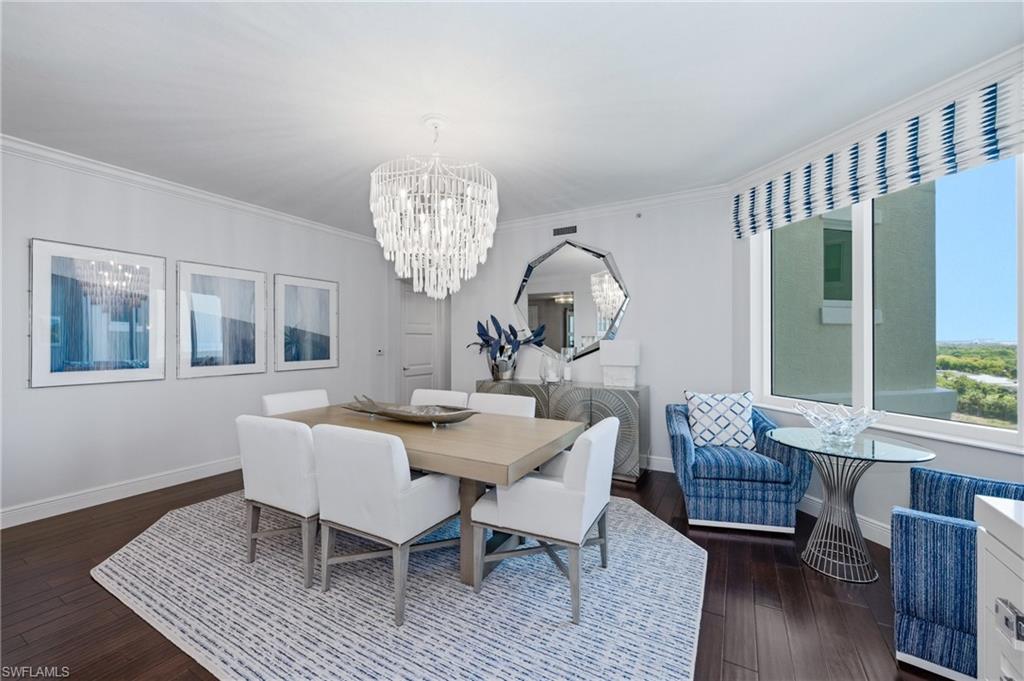 265 Indies Way, Unit 1004 Naples, FL 34110 - Photo 5 of 34 a view of a dining room with furniture window and wooden floor