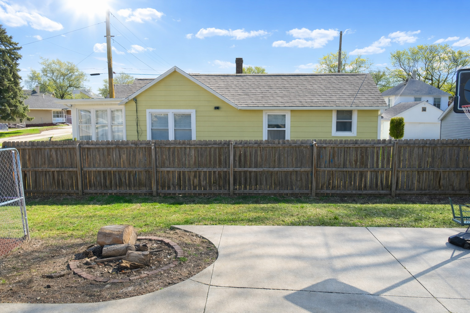 112 7th Avenue Sterling, IL 61081 - Photo 5 of 18 a view of a house with a yard and wooden fence