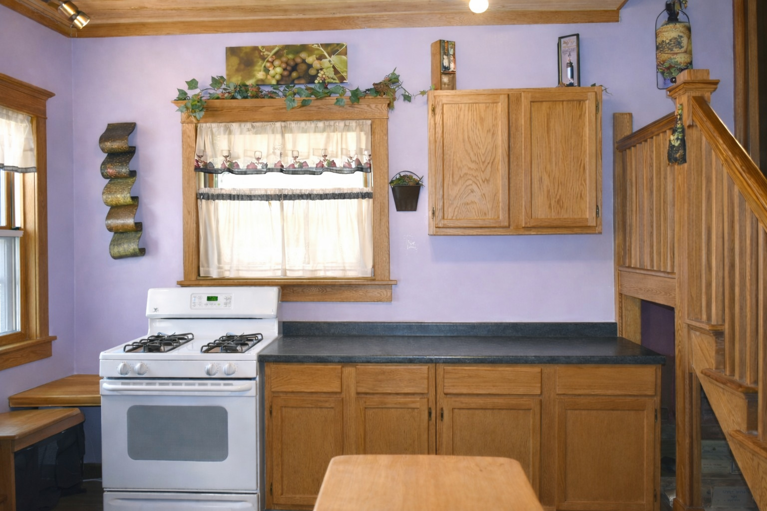 112 7th Avenue Sterling, IL 61081 - Photo 8 of 18 a kitchen with a stove a sink and a window