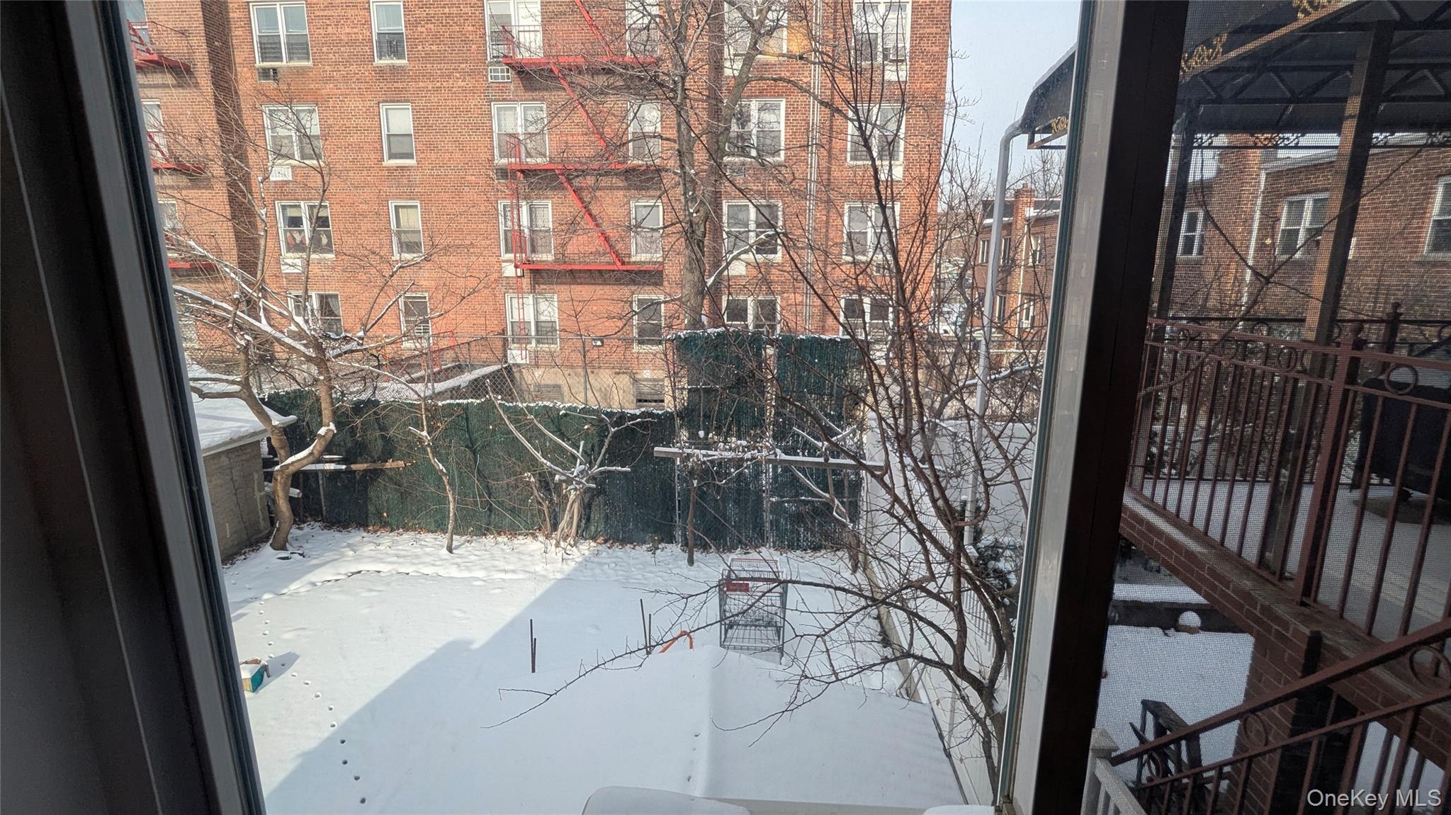 99-47 62nd Road Queens, NY 11374 - Photo 17 of 21 View of snow covered back of property