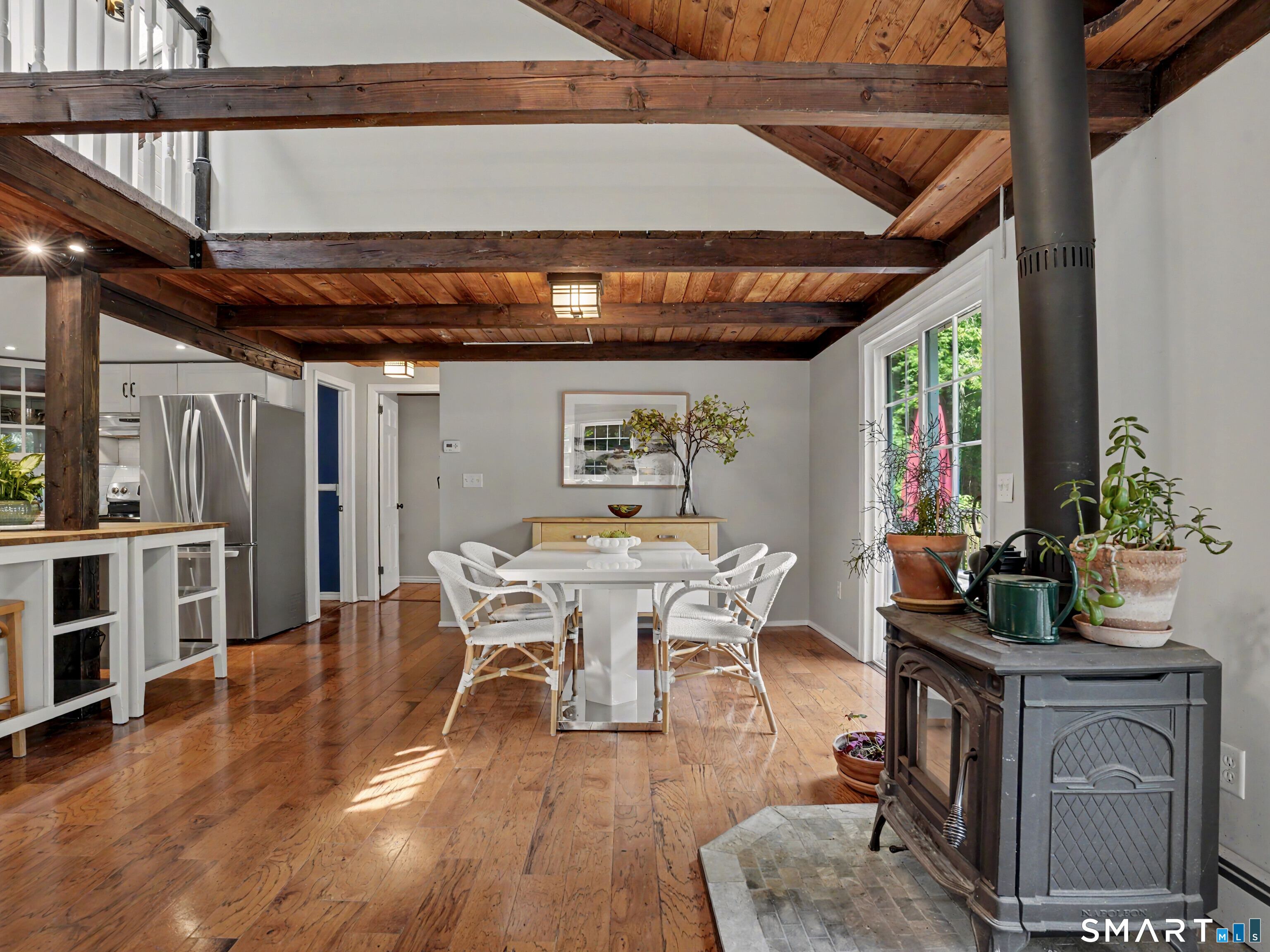 252 Bennetts Farm Road Ridgefield, CT 06877 - Photo 8 of 40 The rustic beams and wide plank wood floors are warmed by a cozy wood-burning stove