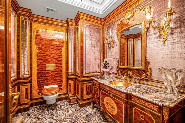 a bathroom with a sink a toilet and shower curtain