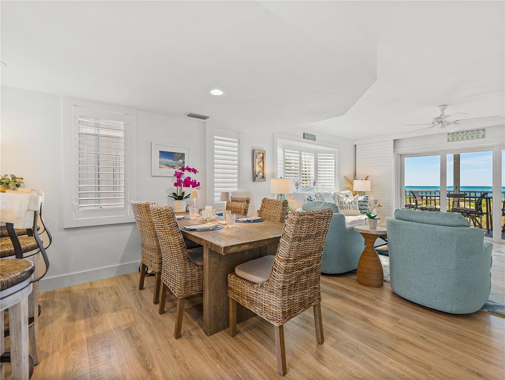 420 Gulf Boulevard, Unit 4 Boca Grande, FL 33921 - Photo 14 of 40 a view of a dining room with furniture and wooden floor