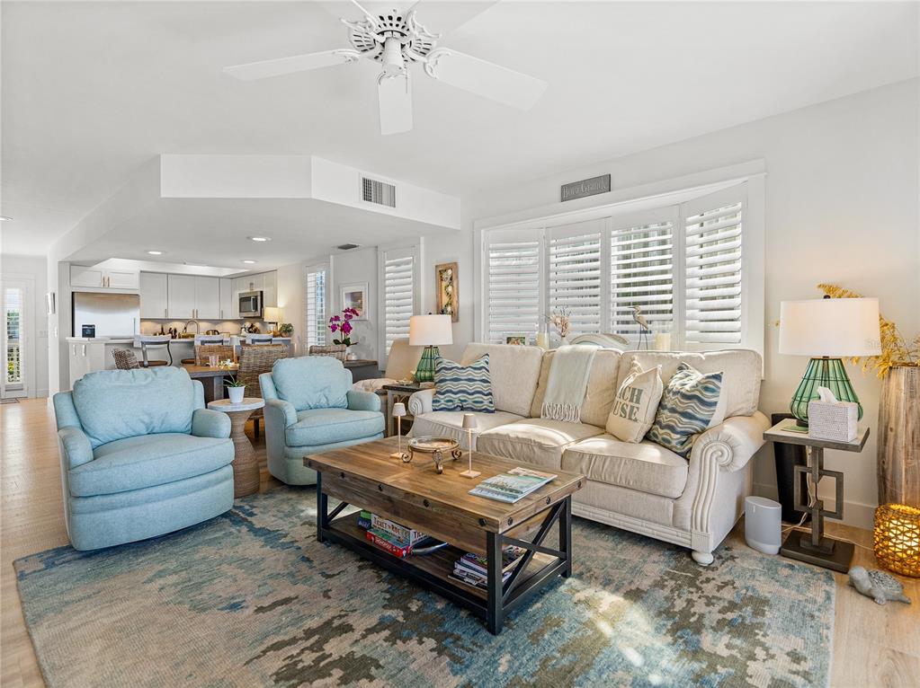 420 Gulf Boulevard, Unit 4 Boca Grande, FL 33921 - Photo 17 of 40 a living room with furniture and a large window