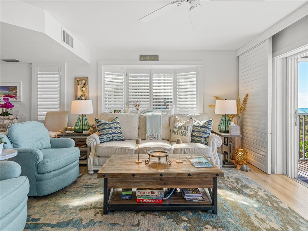 420 Gulf Boulevard, Unit 4 Boca Grande, FL 33921 - Photo 18 of 40 a living room with furniture and a table