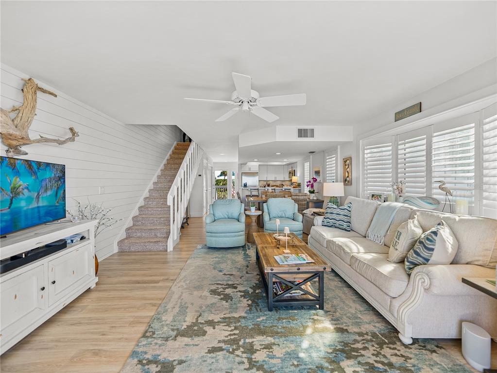420 Gulf Boulevard, Unit 4 Boca Grande, FL 33921 - Photo 23 of 40 a living room with furniture and a flat screen tv