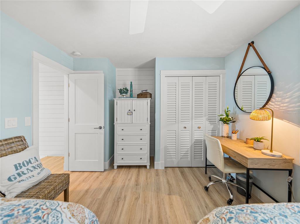 420 Gulf Boulevard, Unit 4 Boca Grande, FL 33921 - Photo 26 of 40 a bedroom with a bed and a dresser