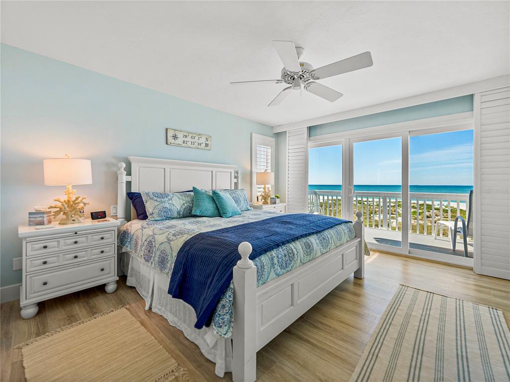 420 Gulf Boulevard, Unit 4 Boca Grande, FL 33921 - Photo 27 of 40 a bedroom with a large bed and a window