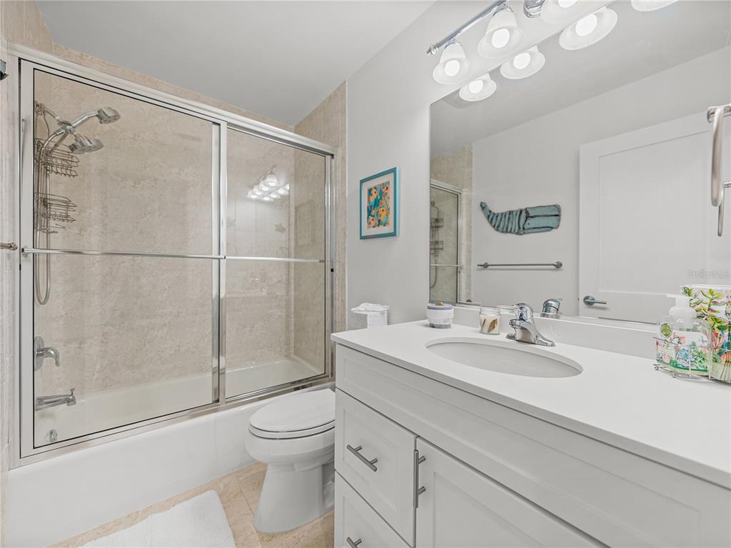 420 Gulf Boulevard, Unit 4 Boca Grande, FL 33921 - Photo 27 of 40 a bathroom with a sink a toilet and shower