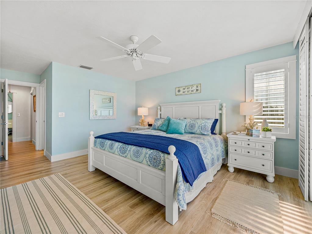 420 Gulf Boulevard, Unit 4 Boca Grande, FL 33921 - Photo 29 of 40 a bedroom with a bed and a window