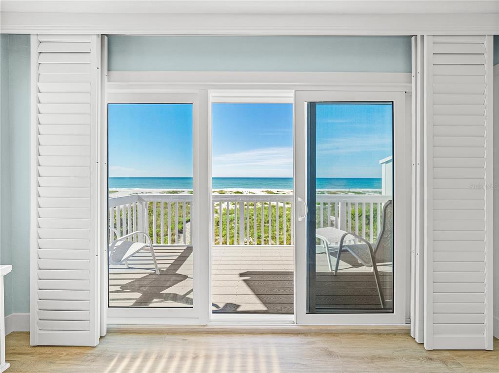 420 Gulf Boulevard, Unit 4 Boca Grande, FL 33921 - Photo 30 of 40 a view of a wooden door and a living room