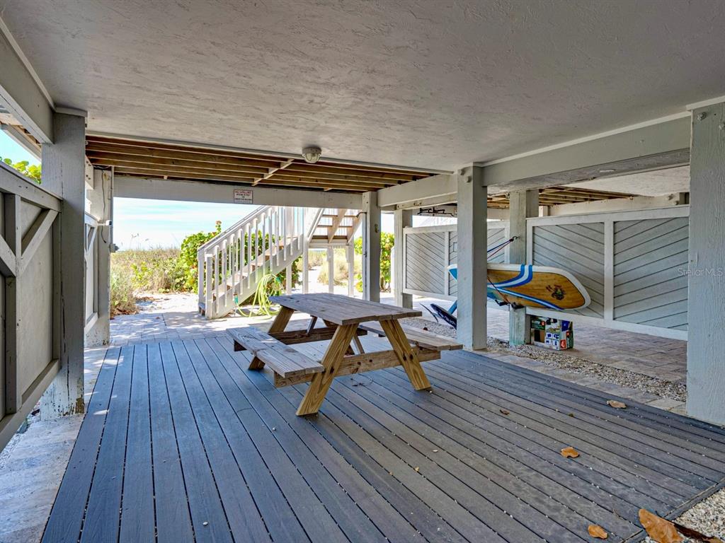 420 Gulf Boulevard, Unit 4 Boca Grande, FL 33921 - Photo 38 of 40 a living room filled with furniture and a wooden floor
