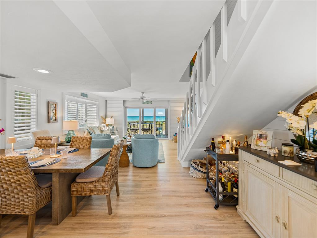 420 Gulf Boulevard, Unit 4 Boca Grande, FL 33921 - Photo 10 of 40 a view of a dining room with furniture window and wooden floor