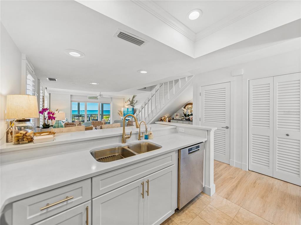 420 Gulf Boulevard, Unit 4 Boca Grande, FL 33921 - Photo 10 of 40 a kitchen that has a lot of cabinets in it