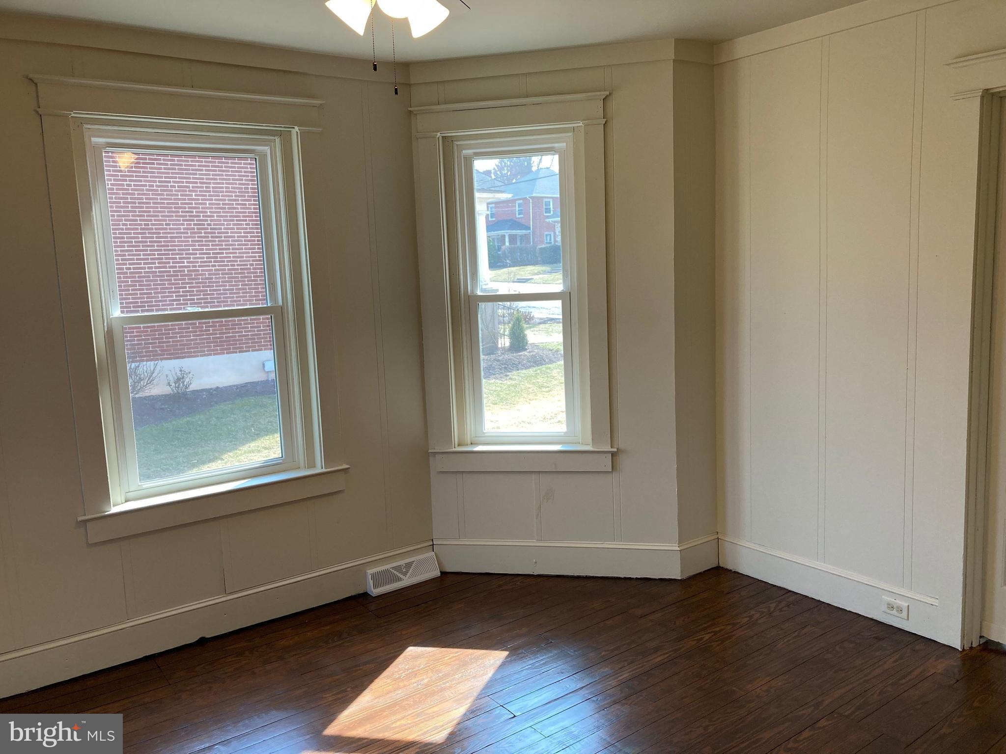 747 Bellevue Avenue Gap, PA 17527 - Photo 11 of 16 a view of an empty room with wooden floor and a window