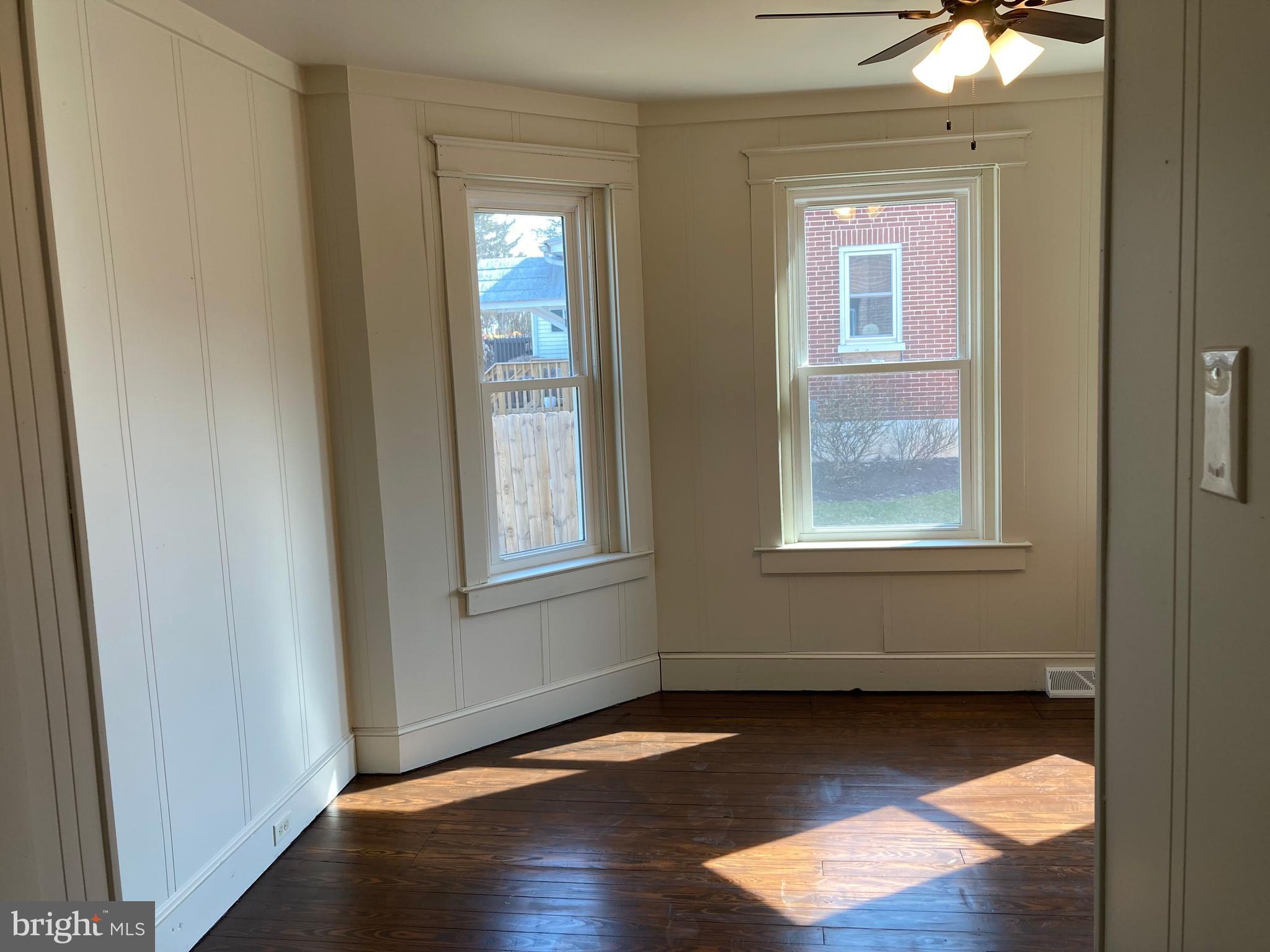 747 Bellevue Avenue Gap, PA 17527 - Photo 12 of 16 an empty room with wooden floor and windows