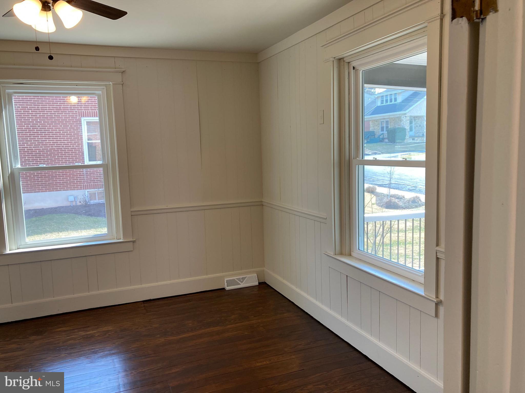 747 Bellevue Avenue Gap, PA 17527 - Photo 14 of 16 a view of an empty room with wooden floor and a window