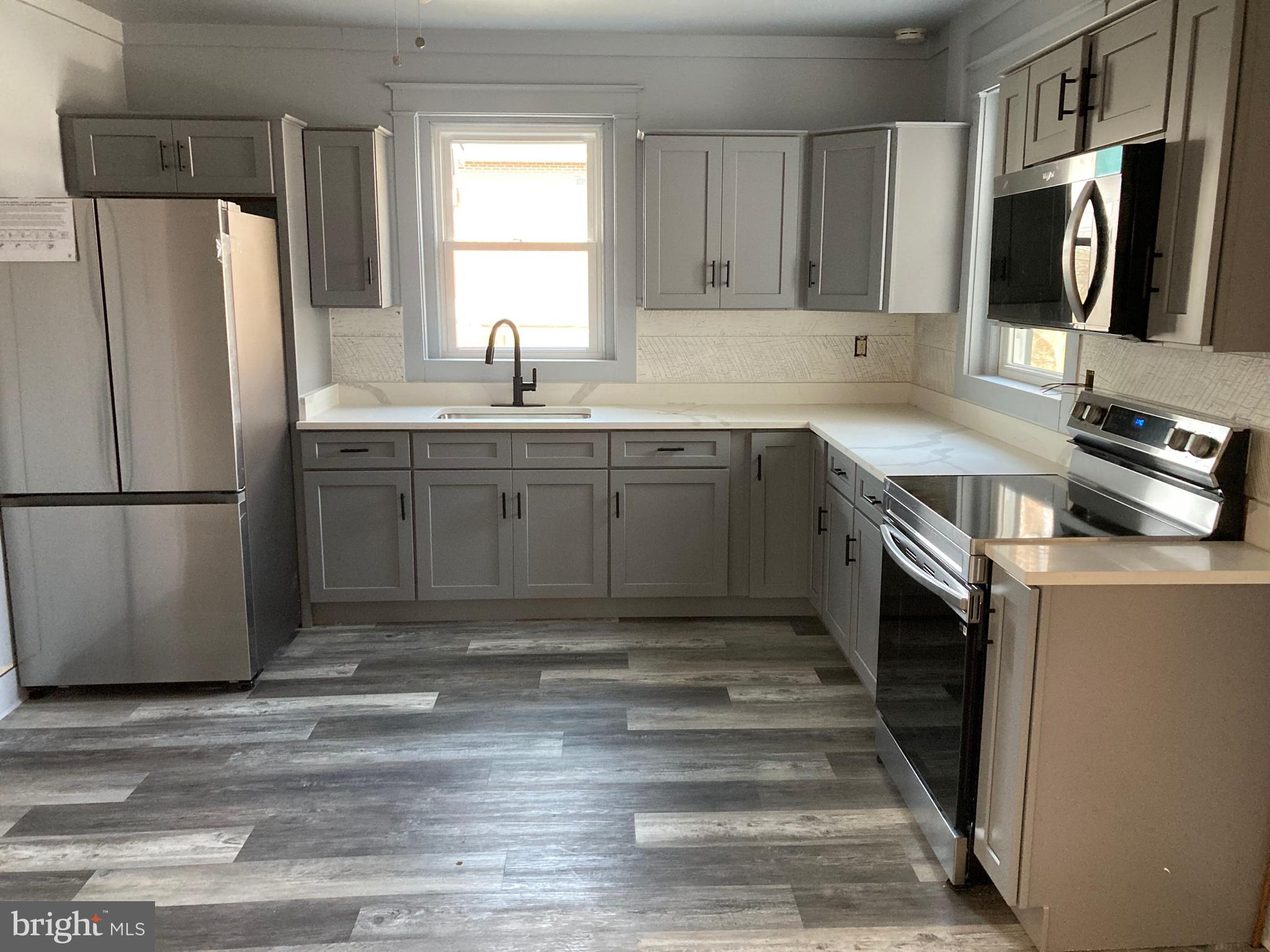 747 Bellevue Avenue Gap, PA 17527 - Photo 5 of 16 a kitchen with stainless steel appliances granite countertop a refrigerator sink and stove