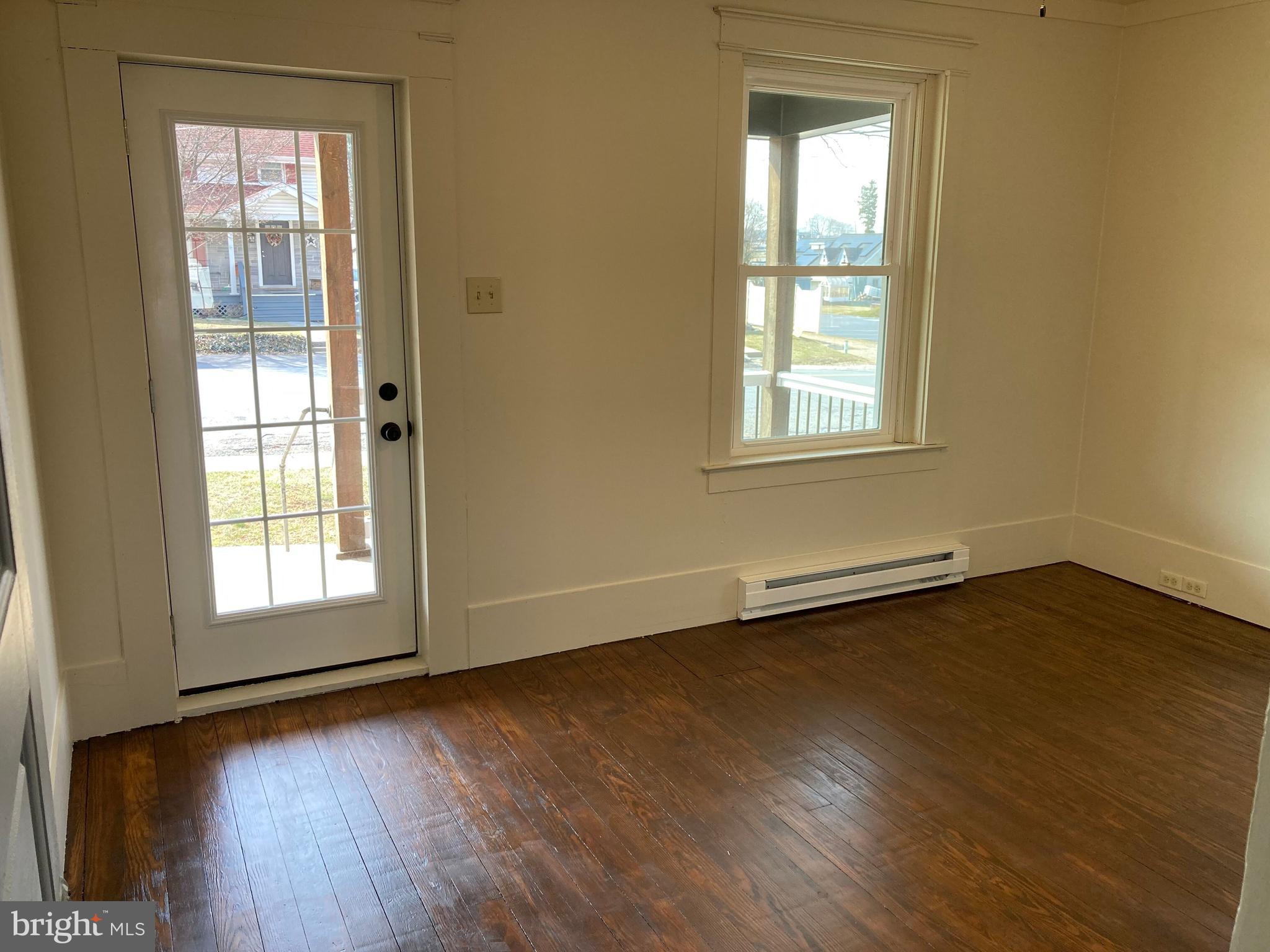 747 Bellevue Avenue Gap, PA 17527 - Photo 6 of 16 an empty room with wooden floor and windows