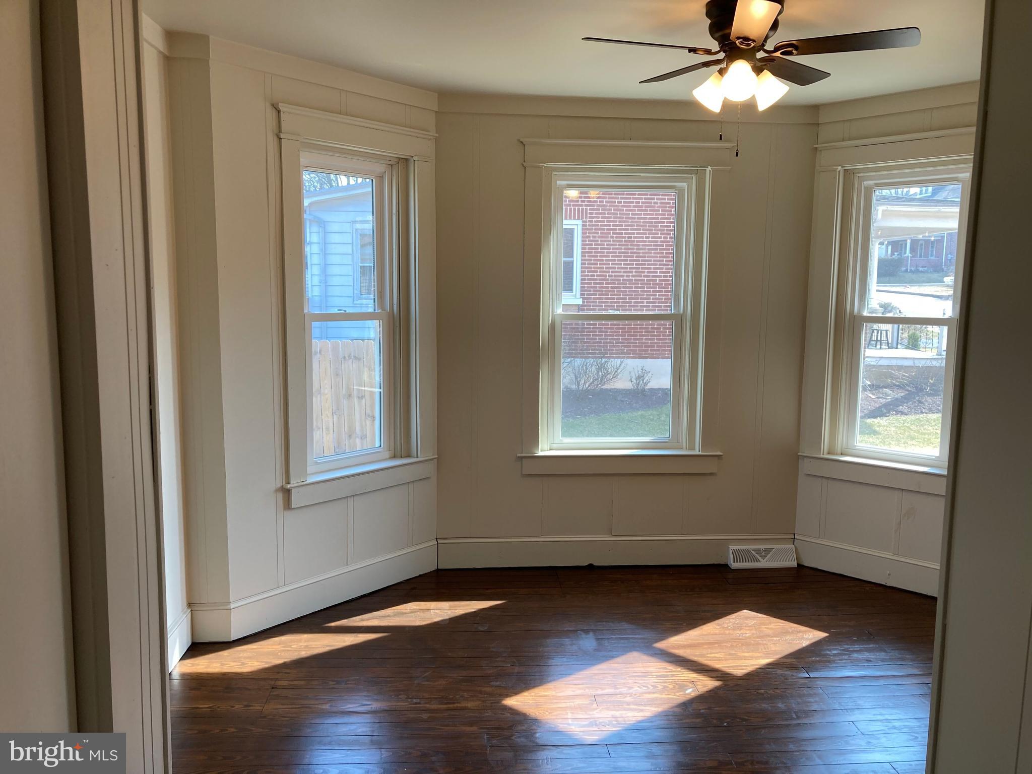 747 Bellevue Avenue Gap, PA 17527 - Photo 10 of 16 a view of an empty room with wooden floor and a window