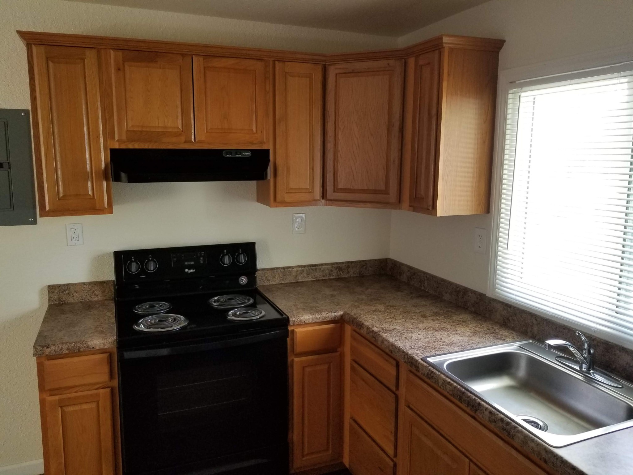104106 Hunter Circle Oak Ridge, TN 37830 - Photo 5 of 15 a kitchen with a sink dishwasher stove and cabinets