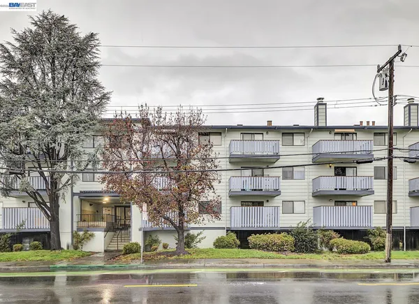 a kitchen that has a sink and a stove in it