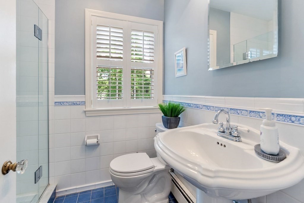 120 Forest Street Wellesley, MA 02481 - Photo 14 of 24 a bathroom with a sink and a toilet