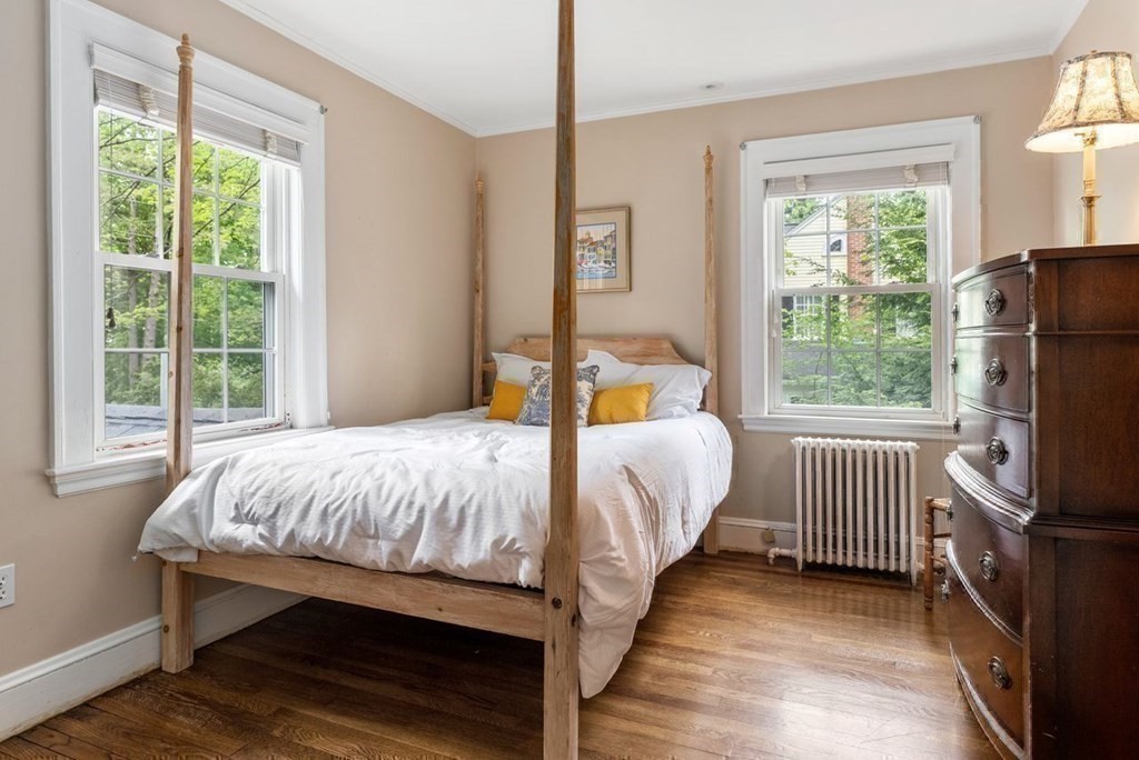120 Forest Street Wellesley, MA 02481 - Photo 15 of 24 a bed sitting in a bedroom next to a window