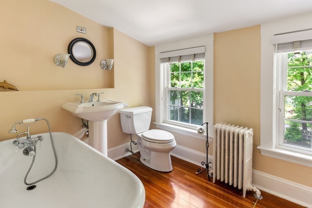 120 Forest Street Wellesley, MA 02481 - Photo 21 of 24 a bathroom with a toilet sink and mirror