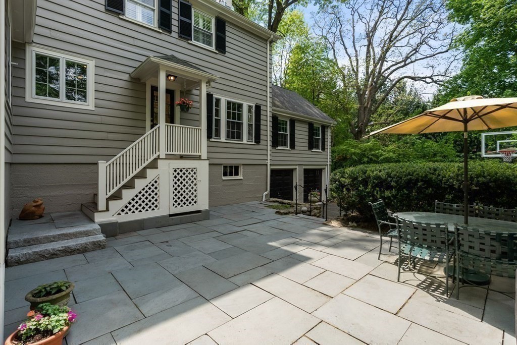 120 Forest Street Wellesley, MA 02481 - Photo 22 of 24 a view of a house with a bench in patio