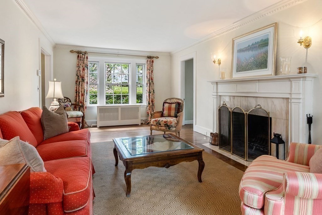 120 Forest Street Wellesley, MA 02481 - Photo 4 of 24 a living room with furniture and a fireplace