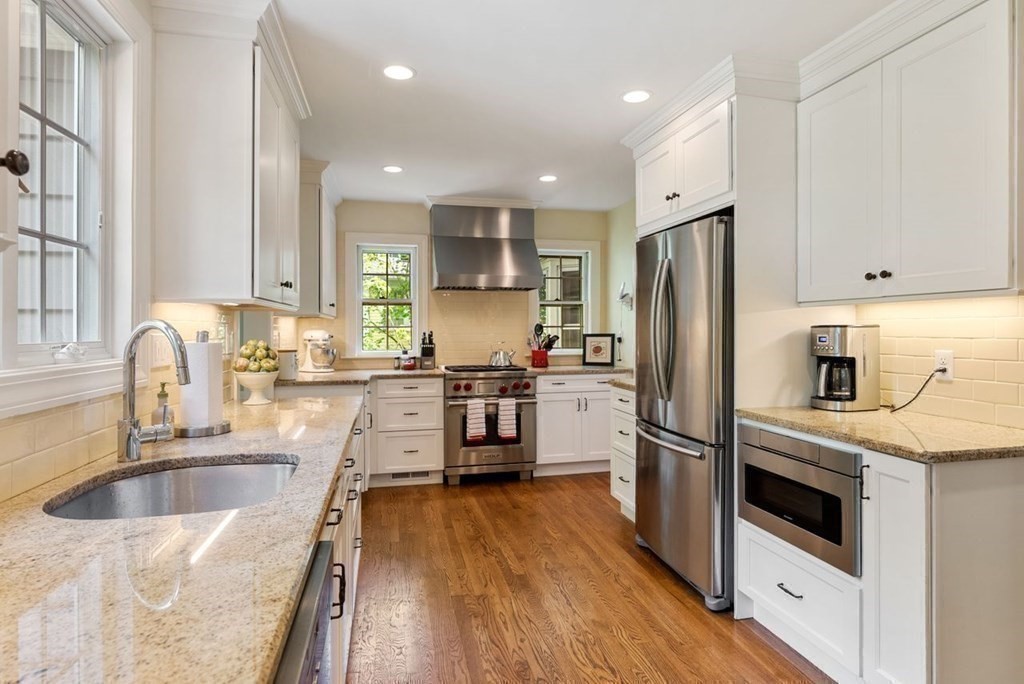 120 Forest Street Wellesley, MA 02481 - Photo 6 of 24 a kitchen with a refrigerator sink and stove