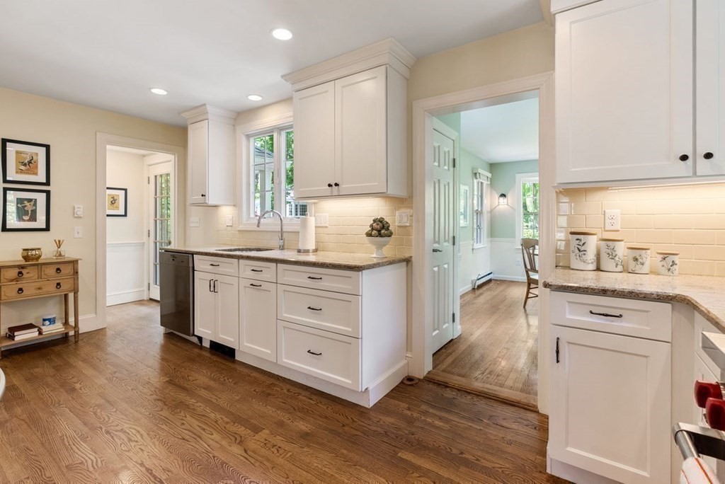 120 Forest Street Wellesley, MA 02481 - Photo 7 of 24 a kitchen with a sink stove and cabinets