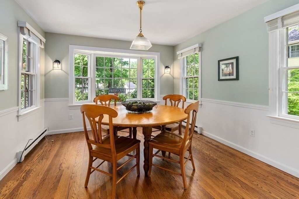 120 Forest Street Wellesley, MA 02481 - Photo 8 of 24 a view of a dining room with furniture window and wooden floor