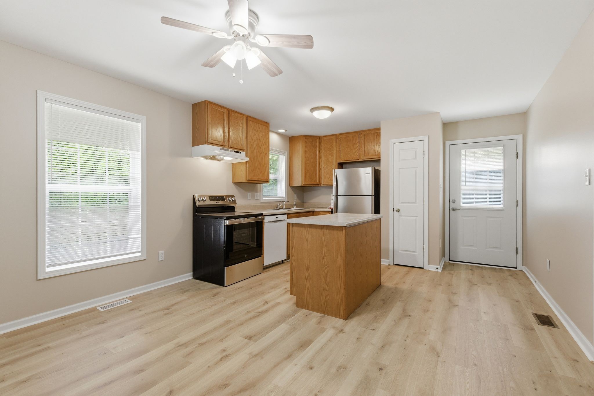 2642 Hibbitts Road Nashville, TN 37214 - Photo 11 of 29 a kitchen with stainless steel appliances granite countertop a stove a sink dishwasher and a refrigerator with wooden floor