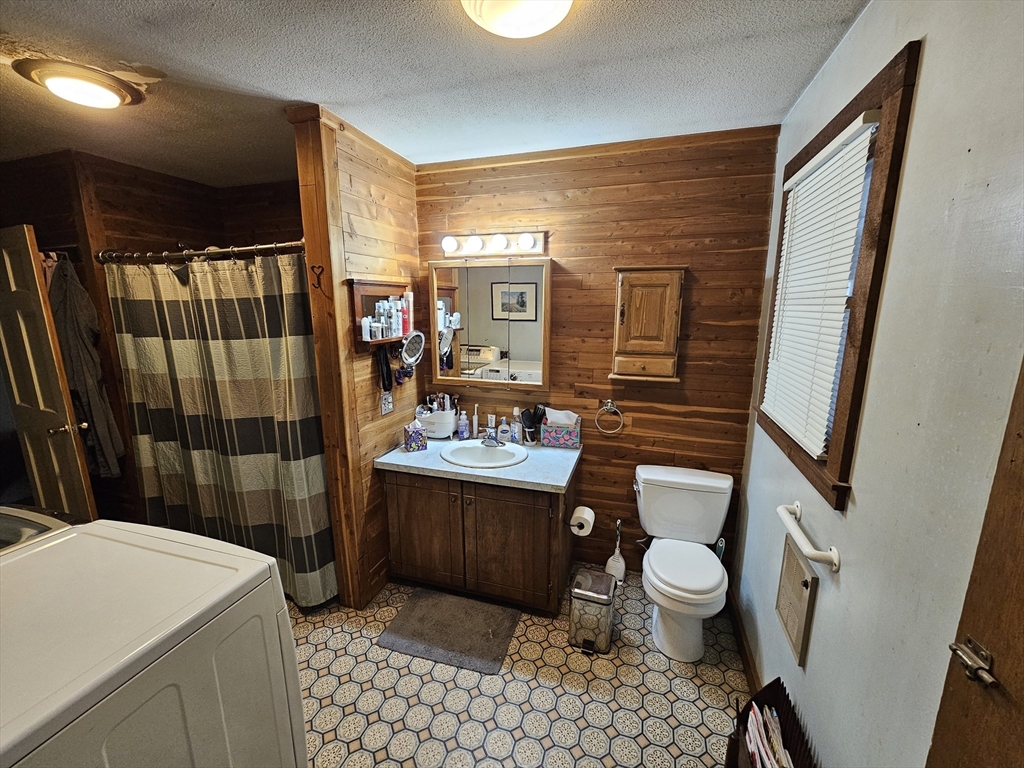 127 Summer Street Thorndike, MA 01079 - Photo 17 of 27 a bathroom with a sink a toilet and shower
