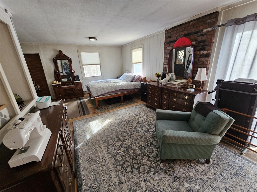 127 Summer Street Thorndike, MA 01079 - Photo 19 of 27 a living room with furniture and a window