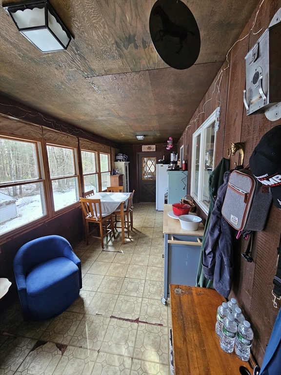 127 Summer Street Thorndike, MA 01079 - Photo 25 of 27 a living room with furniture and a floor to ceiling window